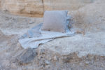 Linen throw blanket used as a picnic or beach cover outdoors