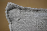 Hidden zipper detail on heavy-weight linen pillow cover