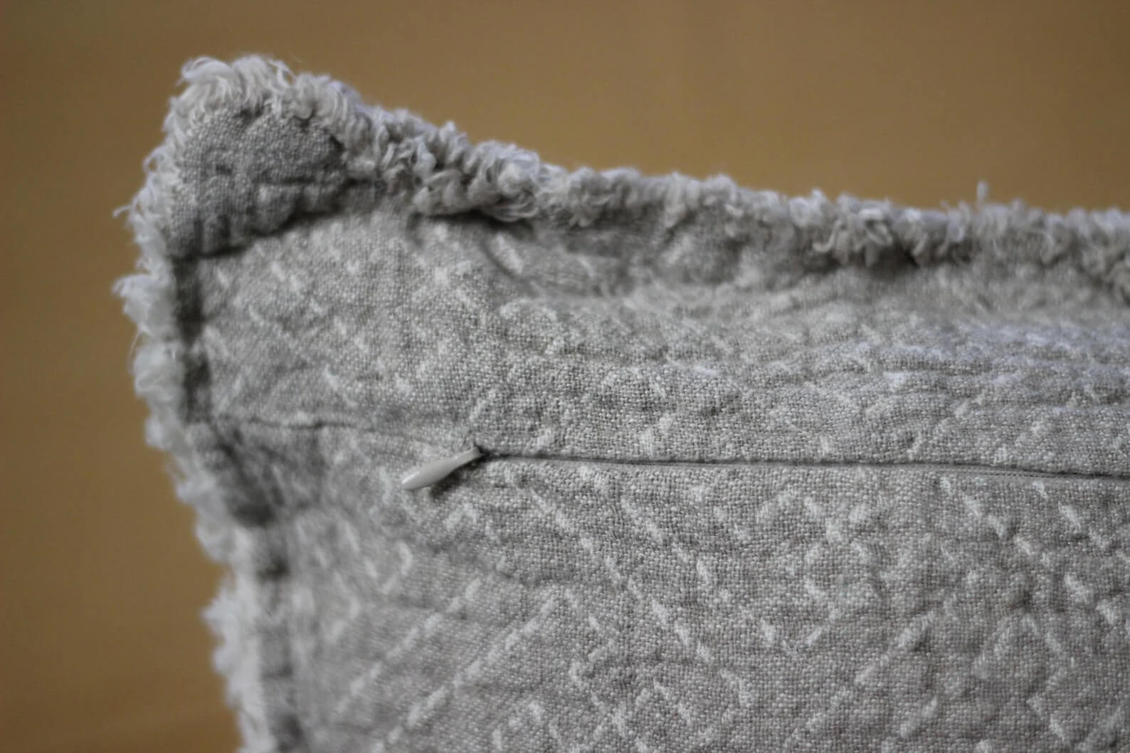 Hidden zipper detail on heavy-weight linen pillow cover