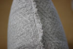 Double-sided linen cushion cover showing natural flax and ivory color contrast