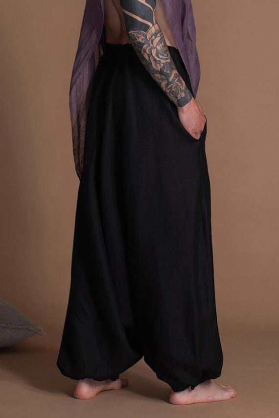 Black men's harem pants with a drop-crotch design, perfect for summer wear