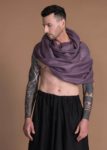 Breathable gauze linen scarf looped effortlessly around the shoulders