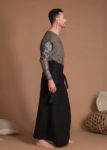 Men wearing a black linen wrap skirt, gender-fluid fashion
