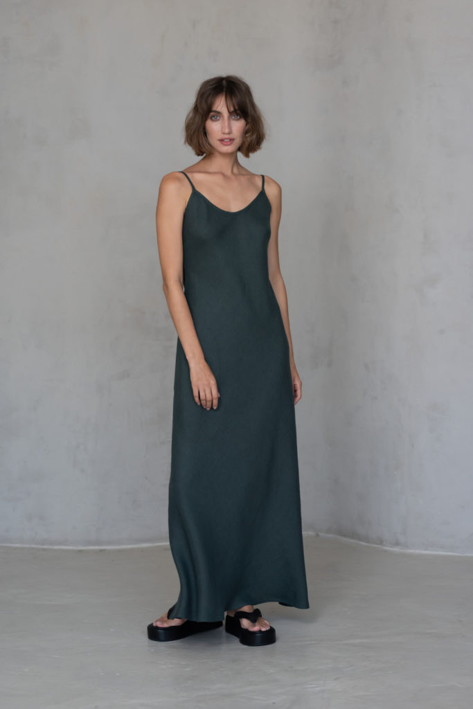 Bias-Cut Linen Dress VERED in dark green, featuring a bias-cut design and adjustable straps for a timeless, elegant fit